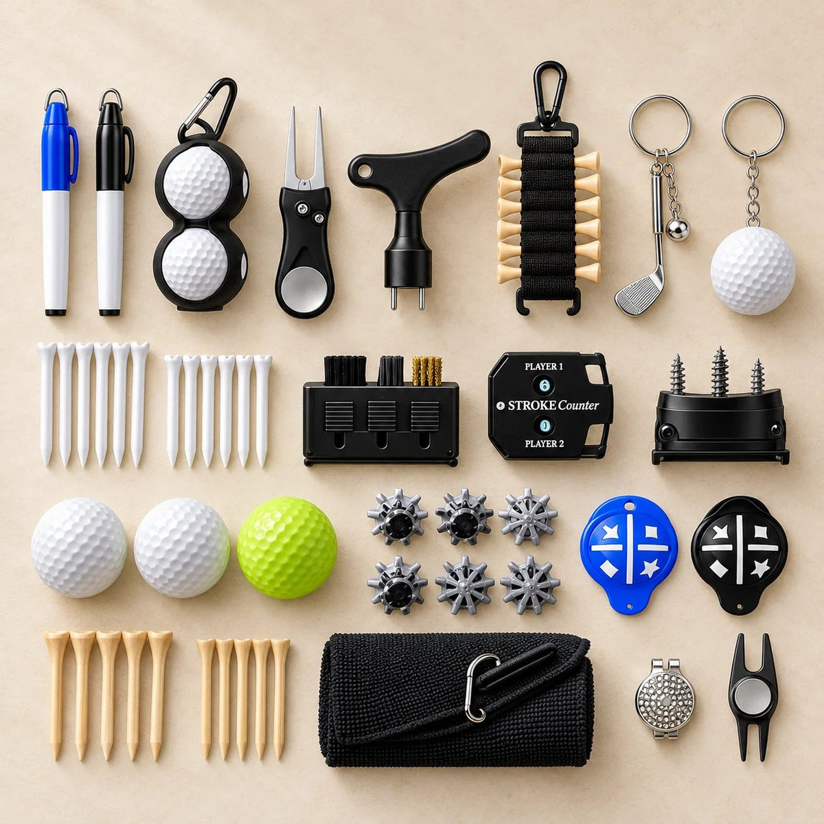 Every item from the calendar laid out: balls, tees, divot tools, towel, brush, spikes, stroke counter and keychains