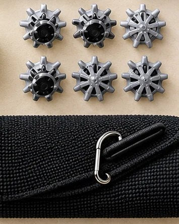 Six replacement golf shoe spikes above a black tri-fold golf towel