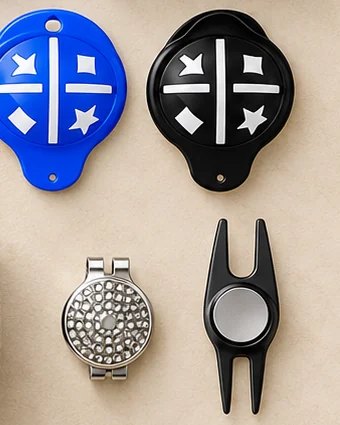 Two ball alignment stencils, a hat-clip ball marker and a divot repair tool